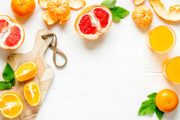 Frame with citrus fruits for juice top view