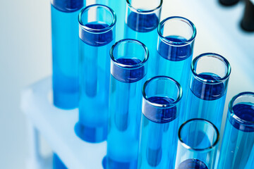 Laboratory test tubes with blue liquid close up