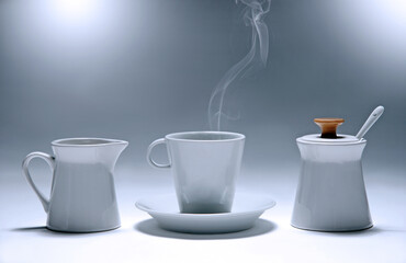 Collection of three cups (for coffee, sugar,milk) isolated on gray.Studio shot.