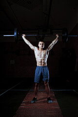 Strong Athlete man lifting weight as a part of workout