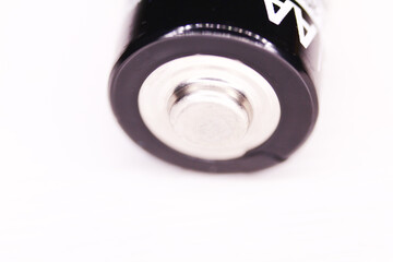 One AA battery isolated on white background. macro shot.