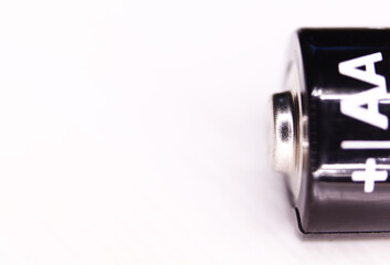 One AA battery isolated on white background. macro shot.