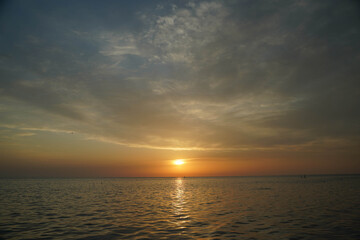 Naklejka na ściany i meble beautiful sunset and sky over the sea