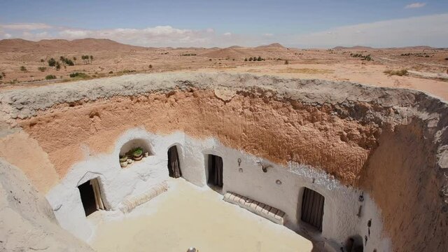 Traditional underground berber home caves in Tunisia deserted area.