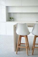 Bright kitchen interior with white chairs style scandinavian