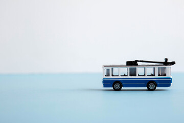 small toy blue and white trolley, place for text 1