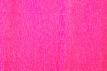 The texture of the corrugated paper. Gift wrapping paper. Pink holiday paper.