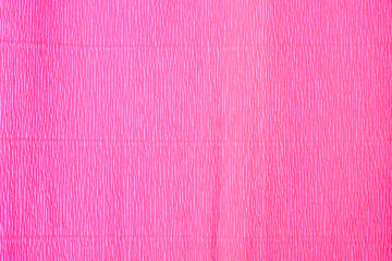The texture of the corrugated paper. Gift wrapping paper. Pink holiday paper.