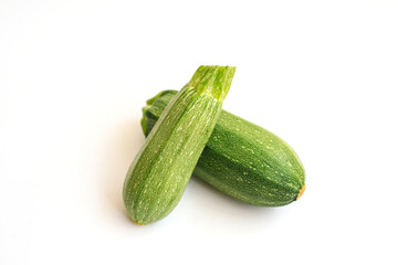 Green zucchini on a white background. The harvest of zucchini.Green vegetables.