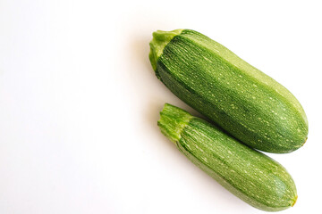 Green zucchini on a white background. The harvest of zucchini.Green vegetables.