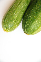 Green zucchini on a white background. The harvest of zucchini.Green vegetables.
