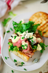 Grilled steak sandwiches with mustard sauce.