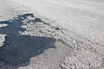 Old damaged asphalt road background