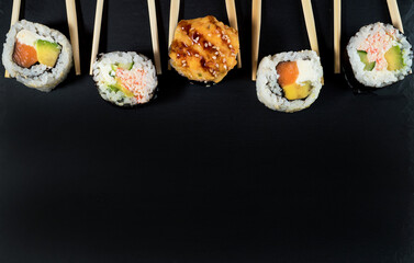 Sushi roll set with chopsticks. Place for your text or logo.