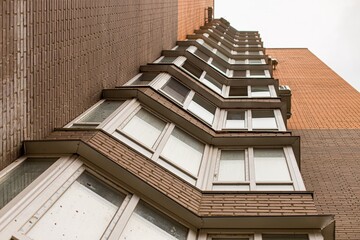 Low angle shot of the windows of a building © Tanya/Wirestock