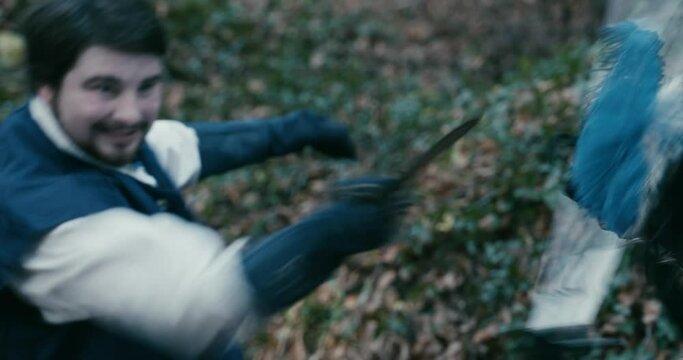 Shoulder Close Up Two musketeers fight sword