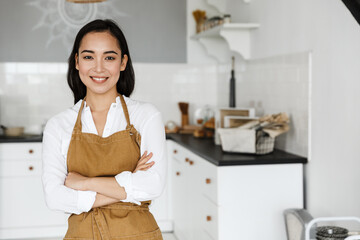 Close up of a confident smiling young asian woman