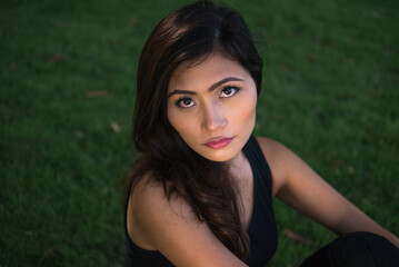 Fototapeta premium Young beautiful Asian woman at the park outdoors