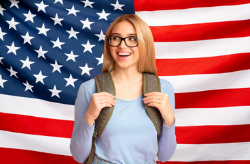 Study In USA. Happy Teen Girl With Backpack Over American Flag Background
