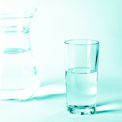 Glass with clean clear water on a white background