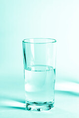 Glass with clean clear water on a white background