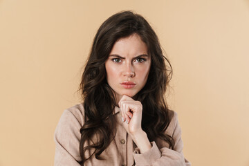 Image of displeased caucasian woman posing and looking at camera