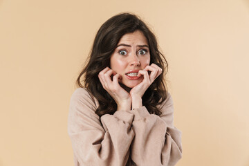 Image of scared attractive woman posing and looking at camera