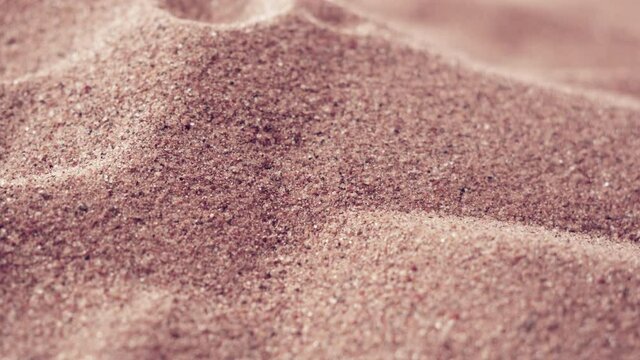 Sand dunes. The principle of movement of dunes in the desert due to the wind. Tilt-shift macro view. Silicon production. Quartz sand. Oxide mineral