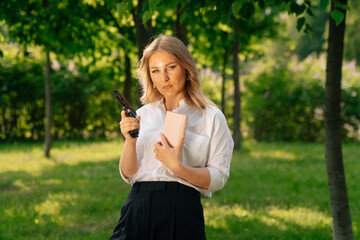Portrait of a stylish woman holding weapon, the concept of a failed purchase . Robbery at a time of crisis