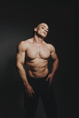 Fototapeta premium A man with raised muscles and a naked torso