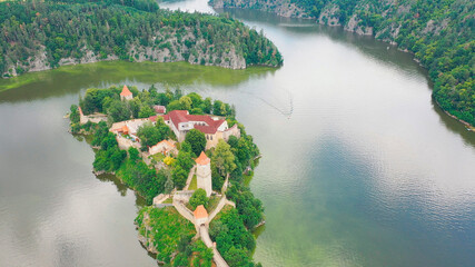 Aerial view on czech medieval castle Zvikov, situated on rocky outcrop above the confluence of two...