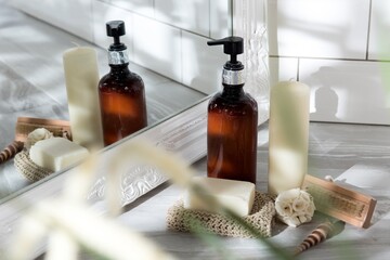 Closeup shot of shower gel candle soup and wooden brush