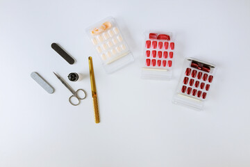 Palette of nail designs of different colors with gel polish on a white tips jars for nail design