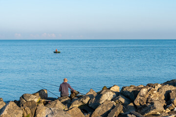Black Sea coast in the city of Poti, fisherman in the boat