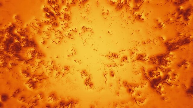 vibrating orange paint with brown spots. abstract looped background