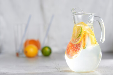 Health care, fitness, healthy nutrition diet concept. Fresh cool homemade citrus infused detox...