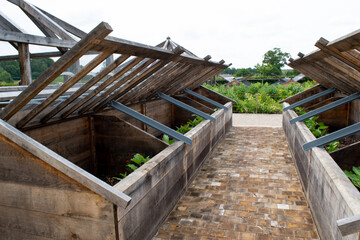 Square wooden vegetable patch in a beautiful country garden in Somerset.