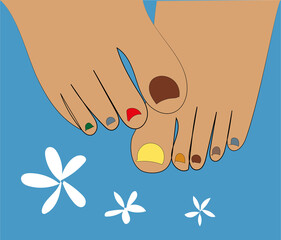 image of toes with multi-colored pedicure on a blue background