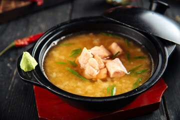 Ishikari miso soup with salmon in a black bowl