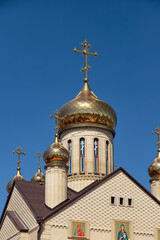 Fototapeta na wymiar Christian Church with Golden domes and crosses