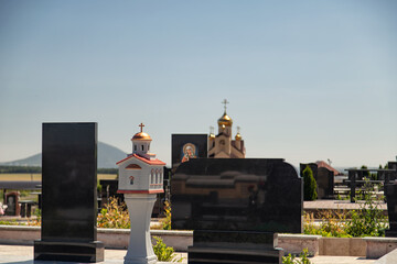 Marble monuments and decorative architectural elements in the cemetery