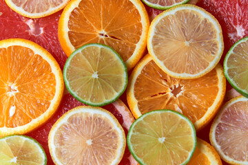 Beautiful fresh sliced mixed citrus fruits like background. Concept of healthy eating, detox, diet....