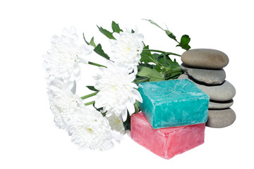 Obraz na płótnie Canvas 2 soaps and 5 stones and white flowers
