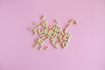 White pill packaging on pink background. Tablets. Close-up.