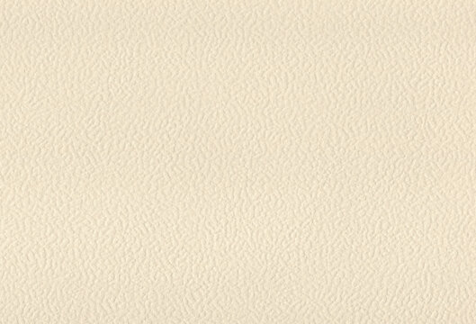 Sheet of textured ivory coloured creative paper background. Extra large highly detailed image.