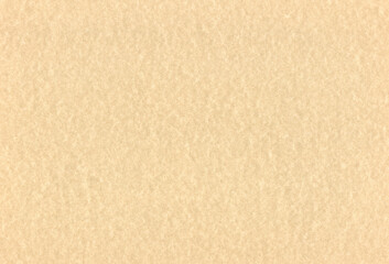 Sheet of textured pale brown coloured recycled creative paper background. Extra large highly detailed image.