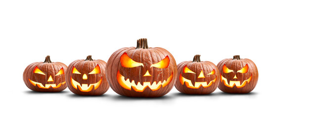 A group of five lit spooky halloween pumpkins, Jack O Lantern with evil face and eyes isolated...