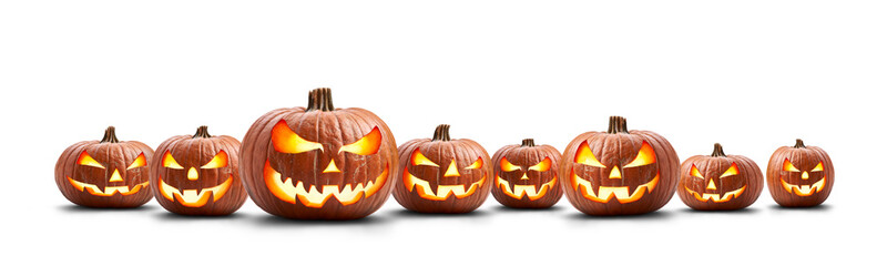A group of eight lit spooky halloween pumpkins, Jack O Lantern with evil face and eyes isolated...