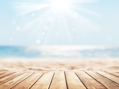 Wooden table top on blue sea and white sand beach background.