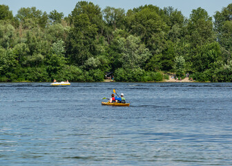 Fototapeta na wymiar Two people kayaking on the river